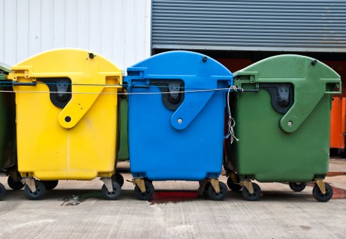 East Ham recycling center with bins and recycling symbols
