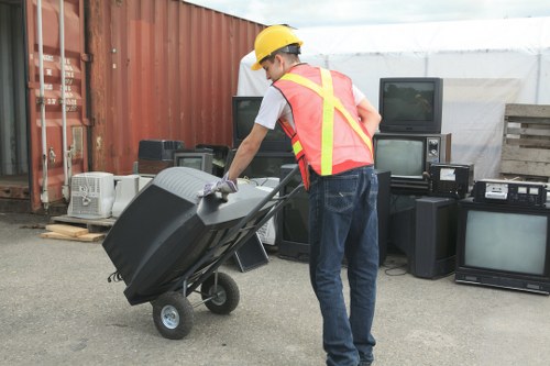 Professional waste disposal team handling construction waste