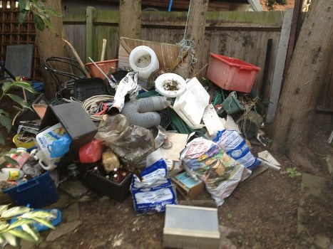 Loading a commercial skip with business waste materials
